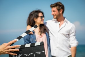 set clapper with couple in background