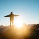 man on hill in sun