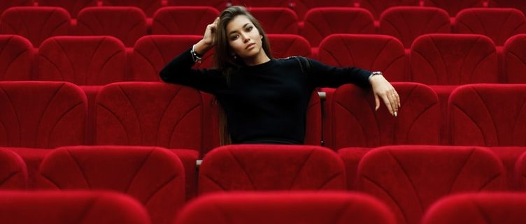 woman sitting in theater